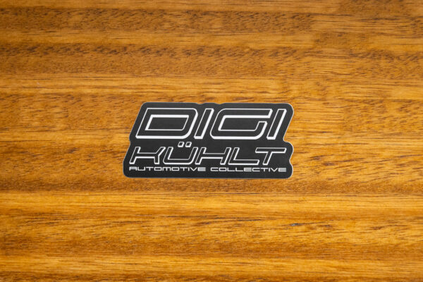 version 1 dk logo black sticker with white letters on wooden table