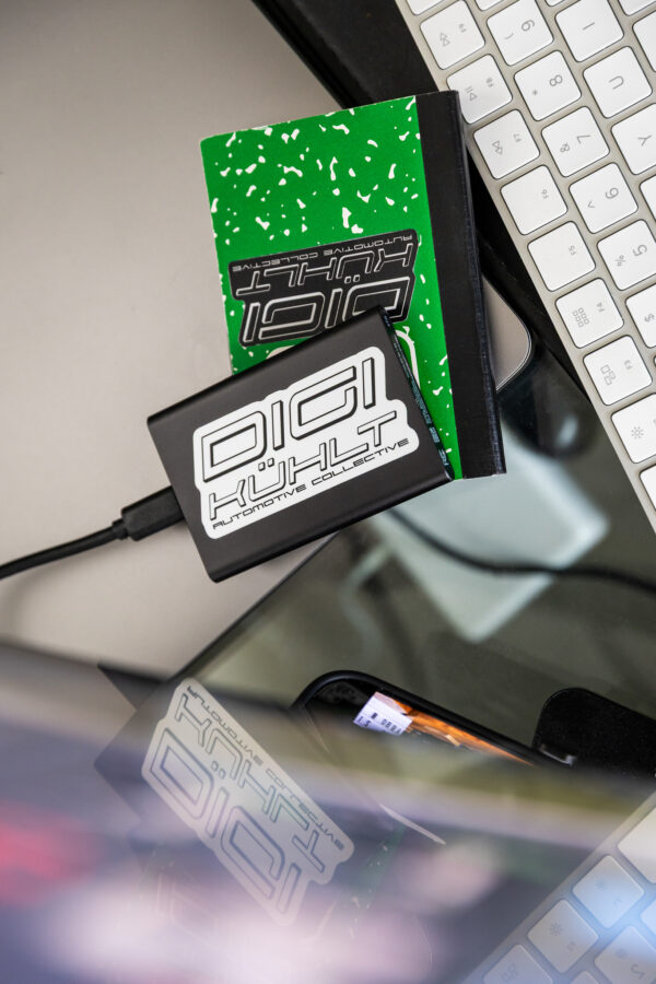 version 1 dk white and black logo stickers on desk top items