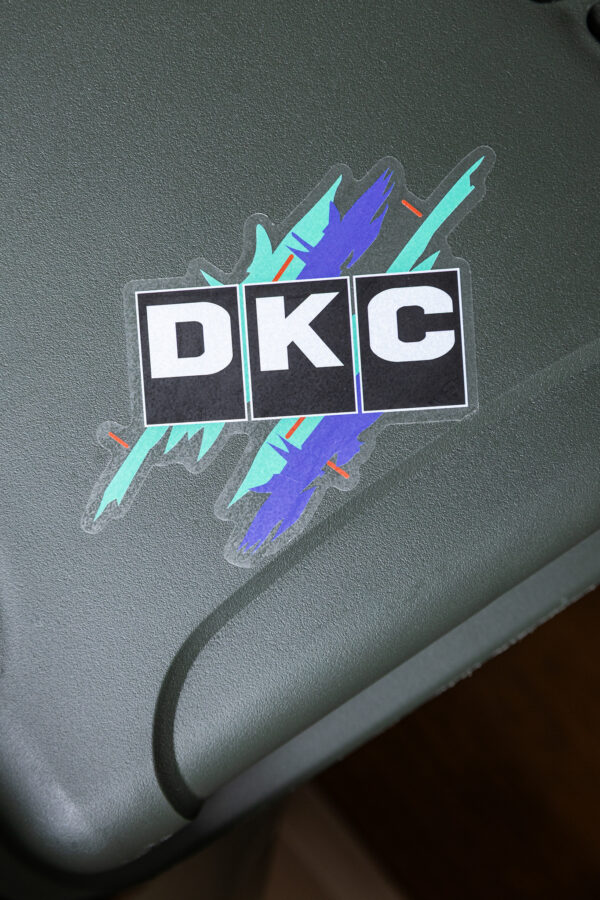 JDM DKC sticker on a large camera case