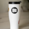 2025 DK logo black sticker on a coffee mug or tumbler