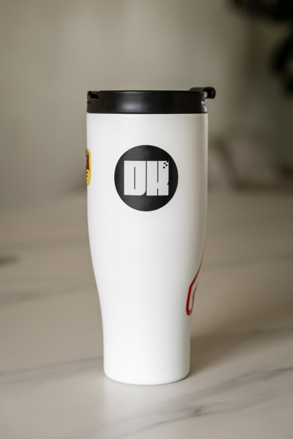 2025 DK logo black sticker on a coffee mug or tumbler